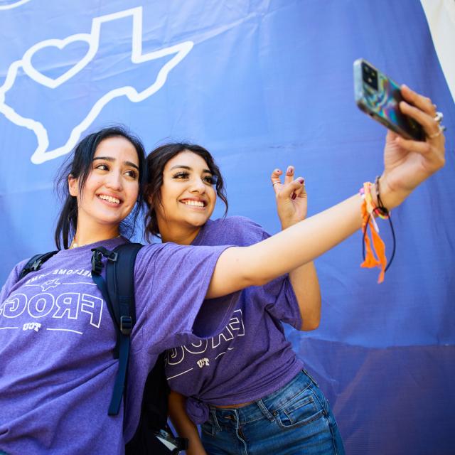 Two girls taking a photo together